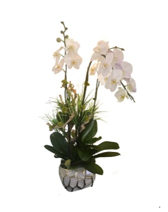 Arrangement no. 9 — Soft blush orchid spray with grasses in a pale stone-look vessel